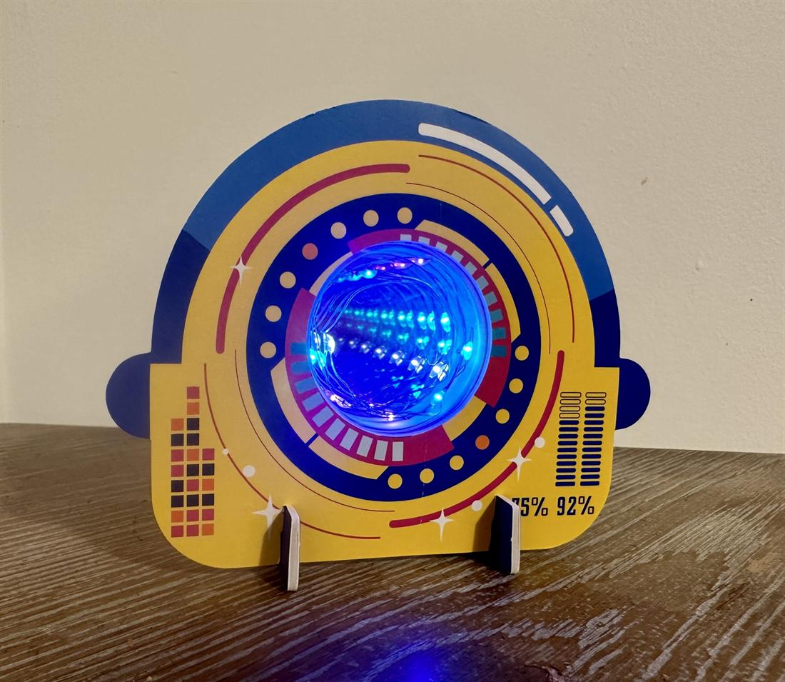 An illuminated space-themed control panel project built at Exploratores